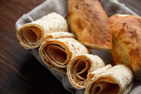 Pita bread of different types in a bread basket . restaurant menuの写真素材