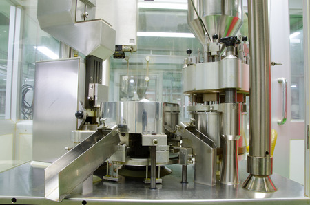 Automatic capsules filling in the plant has received GMP  PICs Pharmaceutical Inspection Co-operation Schemeの写真素材