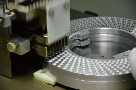 Semi-Automatic capsules filling in the plant has received GMP  PICs Pharmaceutical Inspection Co-operation Schemeの写真素材