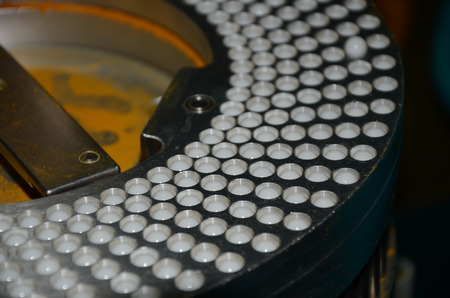 Semi-Automatic capsules filling in the plant has received GMP  PICs Pharmaceutical Inspection Co-operation Schemeの写真素材