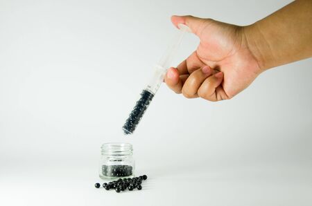 Handle hypodermic syringe pills out of the needle.の写真素材