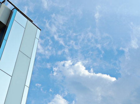 Abstract fragment of contemporary architecture. Residential modern building exterior with blue sky.の写真素材