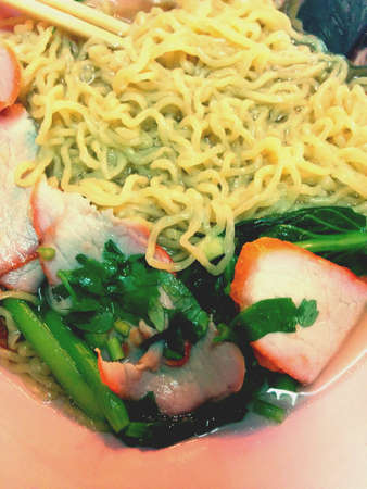 Yellow noodle with red porkの素材