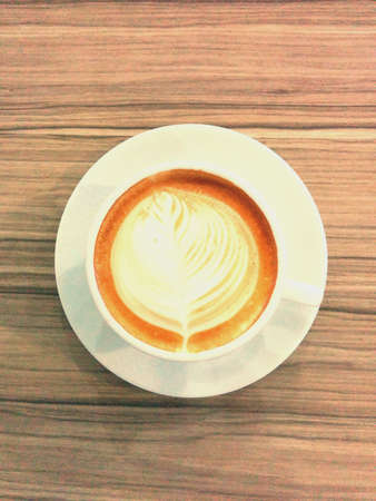 Hot latte coffee on tableの素材
