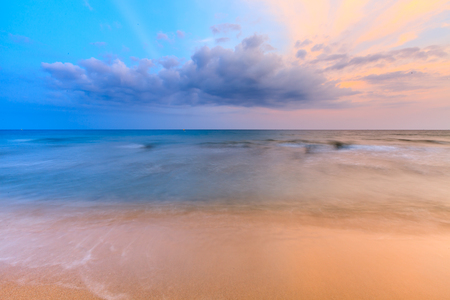 Beautiful sunrise sky over tropical beach and seaの写真素材