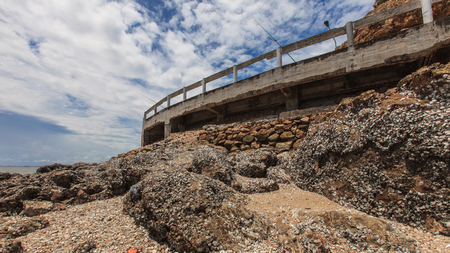 Rock stone coastline and sea waveの写真素材