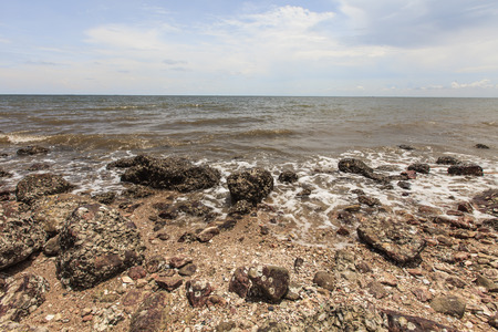 Rock stone coastline and sea waveの写真素材