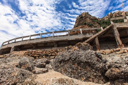 rock coastline and curve roadの写真素材