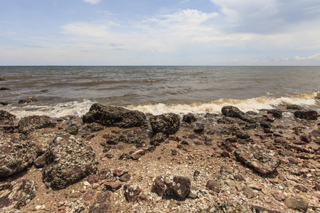 Rock stone coastline and sea waveの写真素材