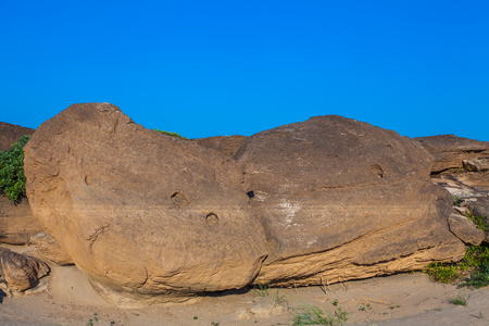 sand rock and sky in thailand drought land and beautiful place in thailand. near rival Kong. famous place and recommend to visit. sam-phan-bok beside river.の写真素材
