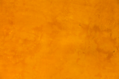 Yellow concrete wall backgroundの写真素材