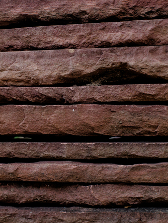 Stacked sand stone floor backgroundの写真素材