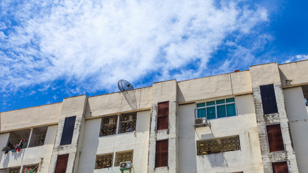 Old condo or office on blue skyの写真素材