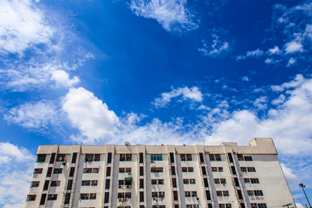 Old condo or office on blue skyの写真素材