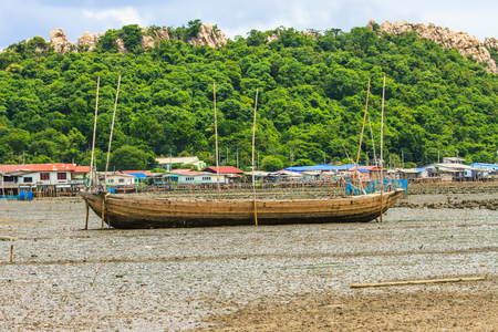 Fisherman boat on sand mudの写真素材