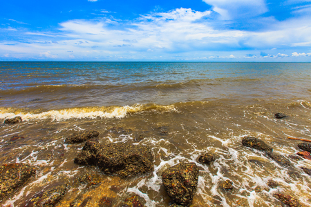 Rock beach and sea waveの写真素材