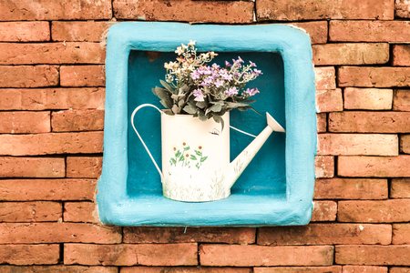 Vintage brick wall decor with flowerの写真素材