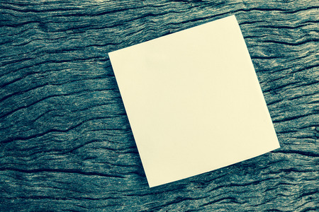 blank note paper on grunge and retro wood backgroundの写真素材