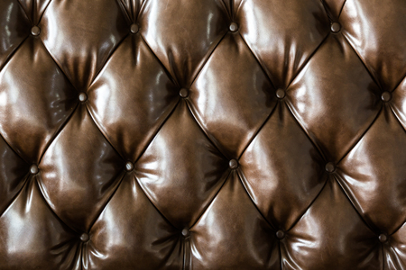 Brown leather sofa pattern backgroundの写真素材