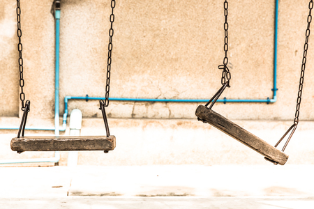 Empty retro wooden chain swingの写真素材