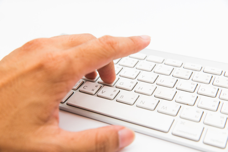 Hand using computer keyboardの写真素材