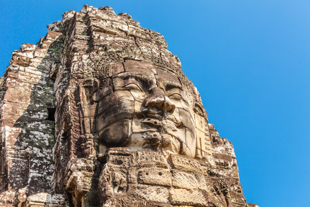 Bayon face in ancient Ankor thom castle in Cambodiaの写真素材