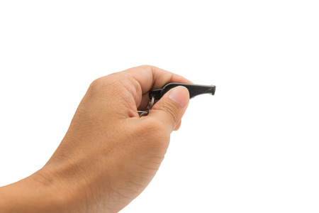 Hand hold whistle on white backgroundの写真素材