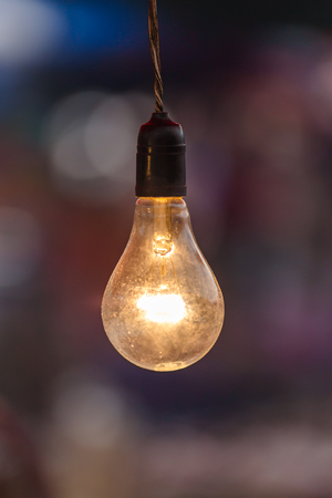 Old light bulb glowingの写真素材