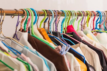 Clothes hanging in wardrobeの写真素材