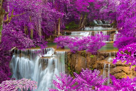 Beautiful waterfall in forest. Autumn filterの写真素材