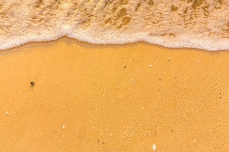 Sea wave flow on soft sand beachの写真素材