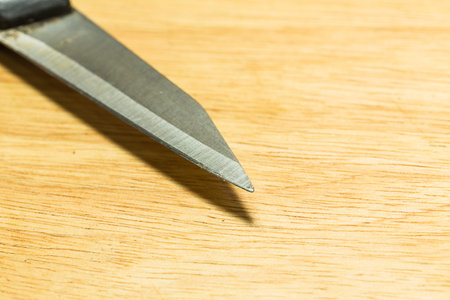 Knife close up on wooden table