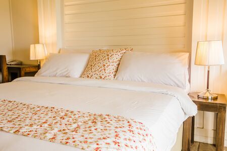 Empty bed in roomの写真素材