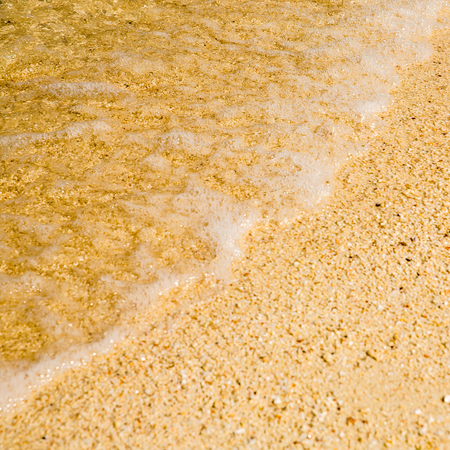 Sand beach and sea waveの写真素材