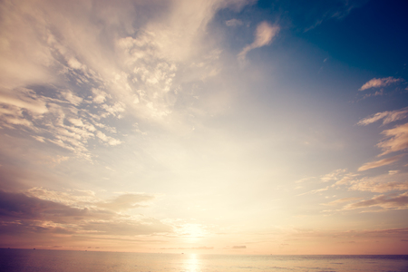 Beautiful sunrise sky over tropical sea. vintage filterの写真素材