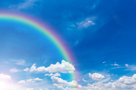 Rainbow on blue sky and cloud backgroundの写真素材