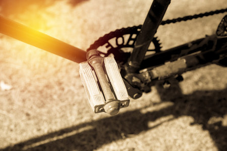 Old bicycle pedal close up. vintage filter