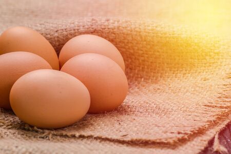 Hen eggs on sackclothes vintage filterの写真素材