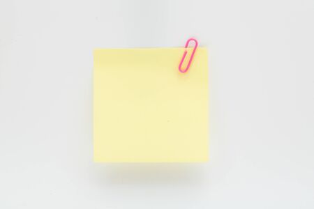 Blank paper note with pink clip for messageの写真素材