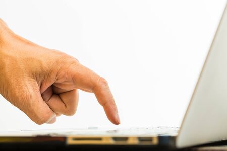 Hand using computer laptop PC on white backgroundの写真素材