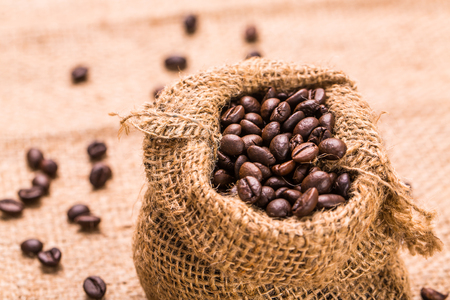 Roasted coffee bean in sackcloth bagの写真素材