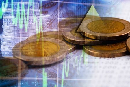 Double exposure money on bank account with business trading graphの写真素材