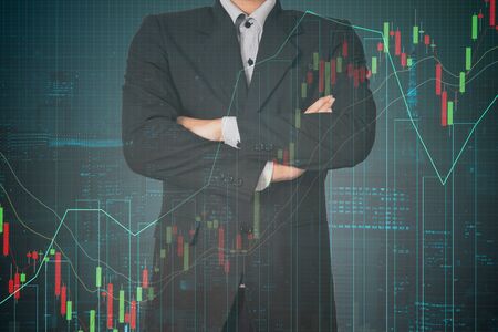 Double exposure business man on trading investment graph and financial city backgroundの写真素材