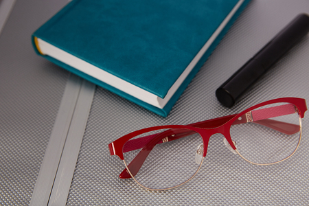 Glasses on a metallic backgroundの写真素材