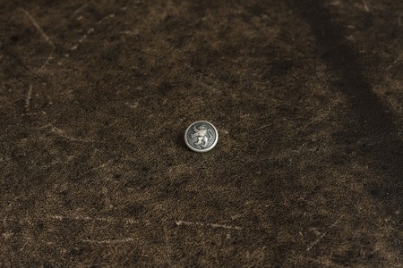 Metal button on the texture tableの写真素材