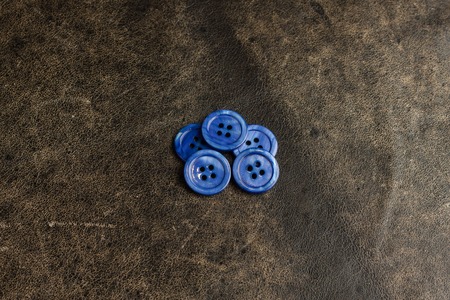 Blue buttons on the texture tableの写真素材