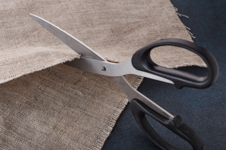 The tailor's scissors cut linen cloth.の写真素材