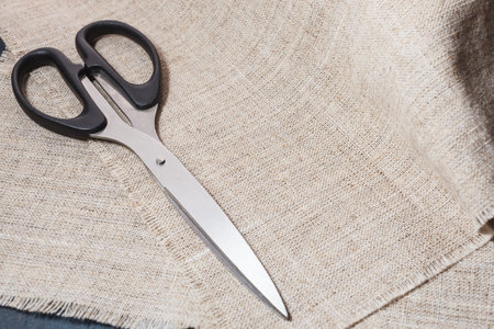 Portnevsky scissors on a background of linen cloth.の写真素材