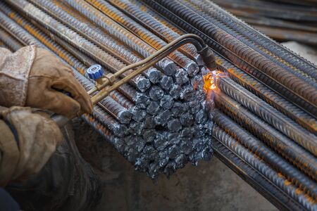 Gas cutting of metal fittings. Working gloves. Sparks.の写真素材