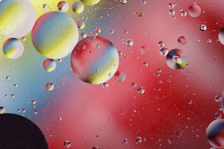 Abstract image with colorful circles and shapeless bodies on a colored background.の写真素材
